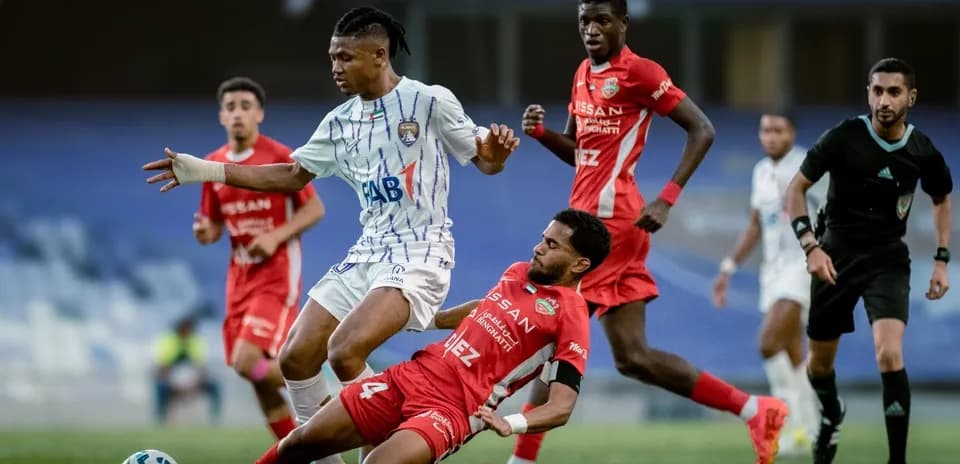 Al Ain U23 player dribbling past Al Sharjah U23 opponent