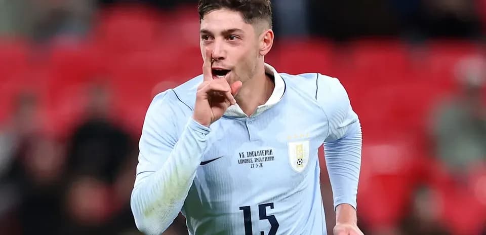Player celebrating a goal with a shushing gesture