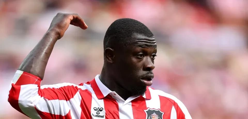Player gesturing during match in Sunderland kit
