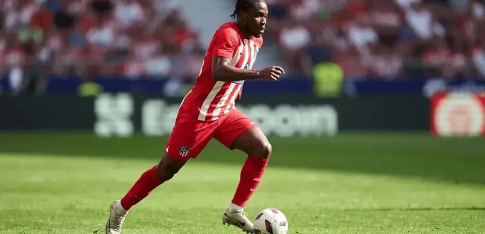 Atletico Madrid player running with the ball