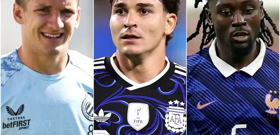 Three football players in team jerseys posing together
