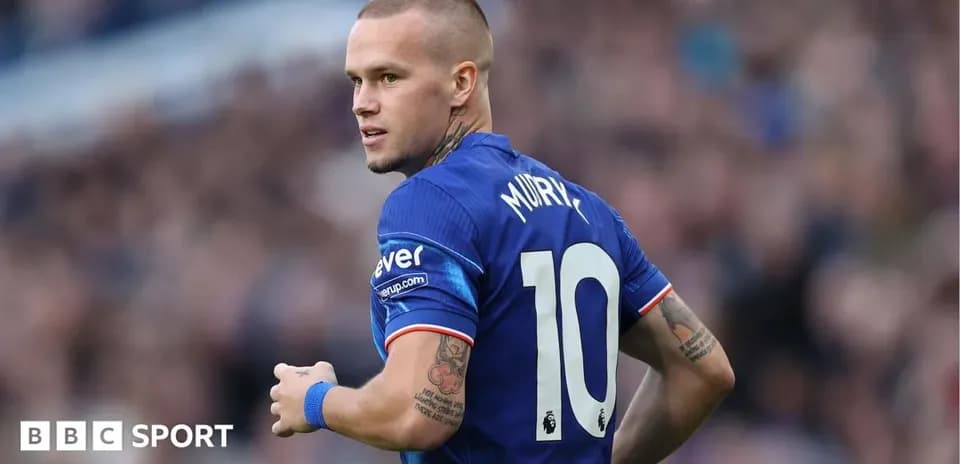 Player wearing blue jersey with number 10