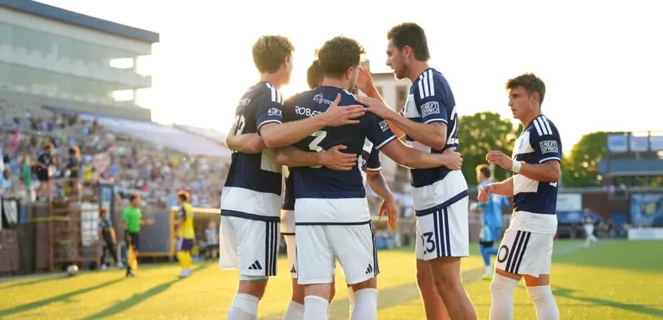 Players celebrating a goal during MLS Next Pro match