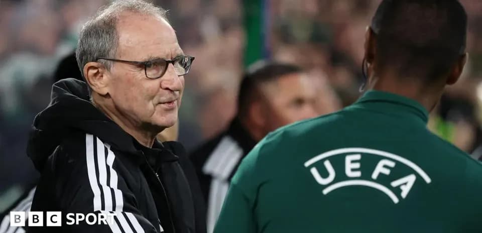 Coach interacting with official during match
