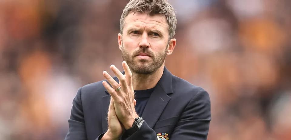 Coach applauding during a match on the sidelines