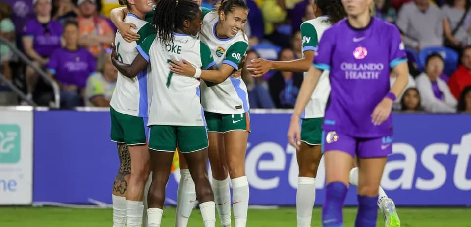 Players celebrating after scoring a goal