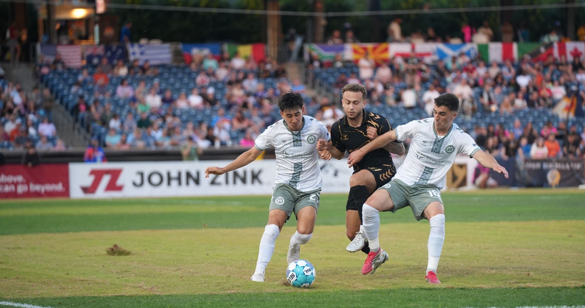 Players competing for the ball during match