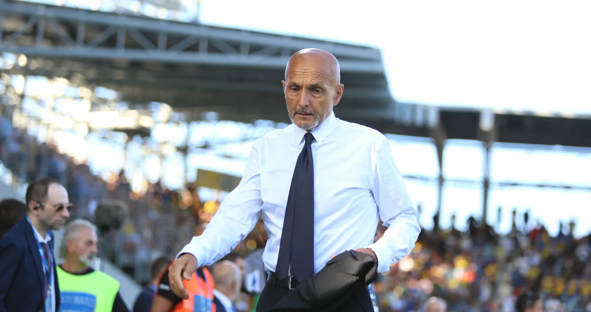 Coach walking on the sidelines during a match