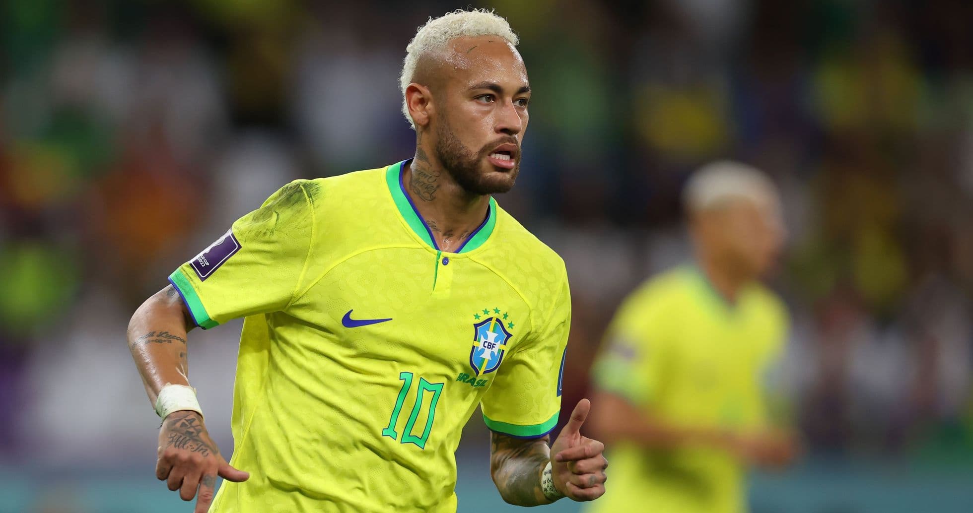 Neymar celebrating in Brazil's yellow jersey during match