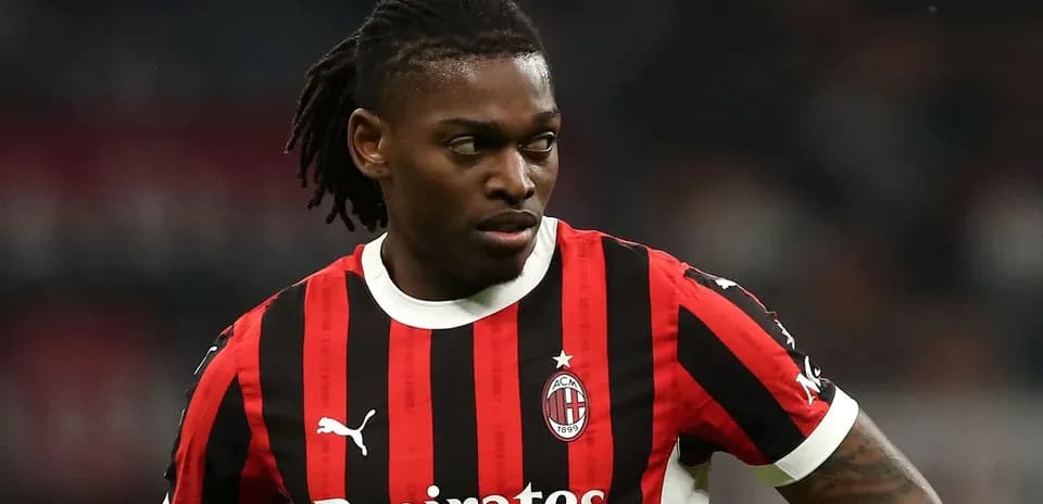 Player in AC Milan jersey during match action