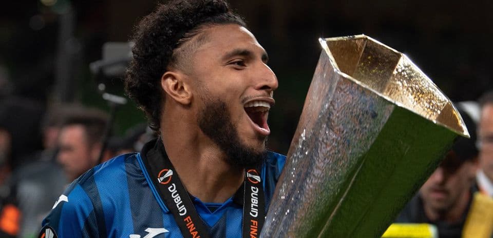 Player celebrating with trophy after match victory