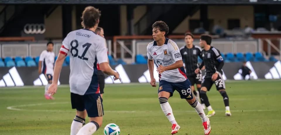 Players from Town and Real Monarchs in action