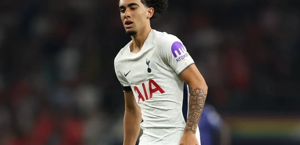 Player wearing Tottenham kit during match action