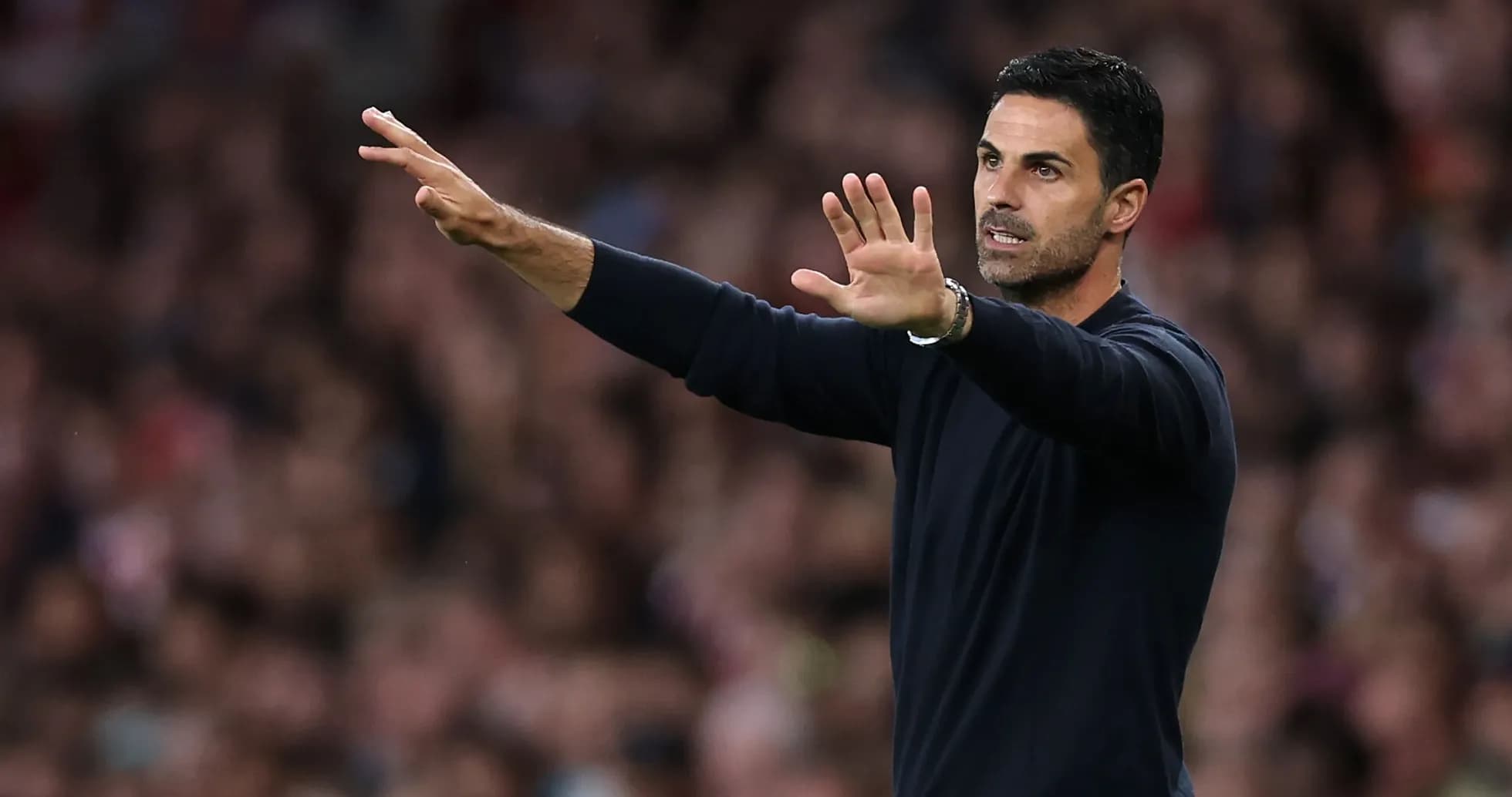 Coach gesturing during a football match