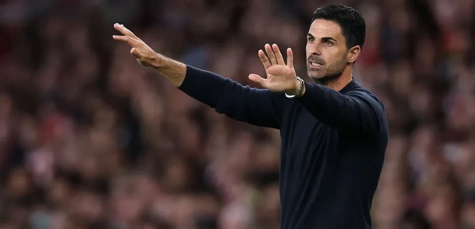 Coach gesturing during a football match