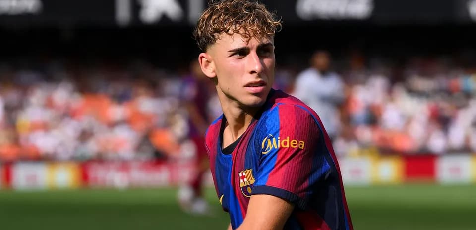 Barcelona player looking on during match action