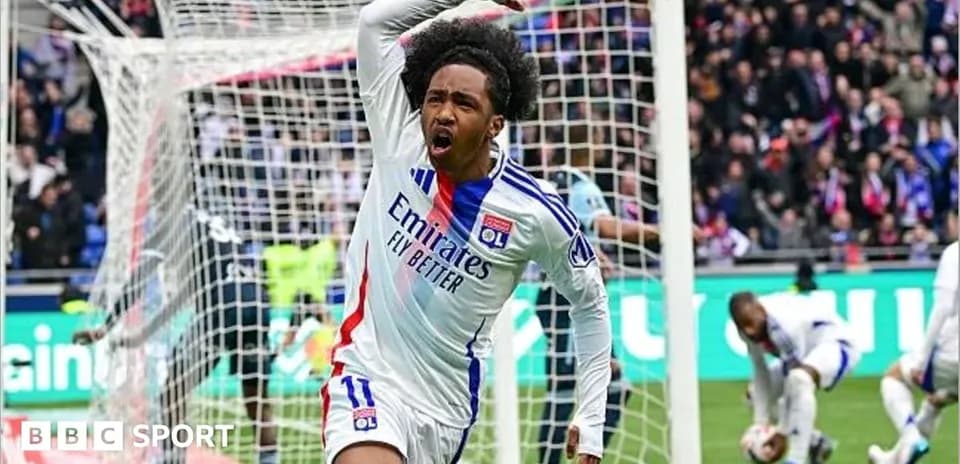 Player celebrating a goal in front of the net