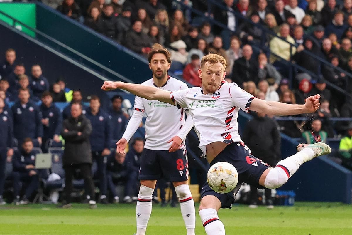 Player kicking the ball during a football match