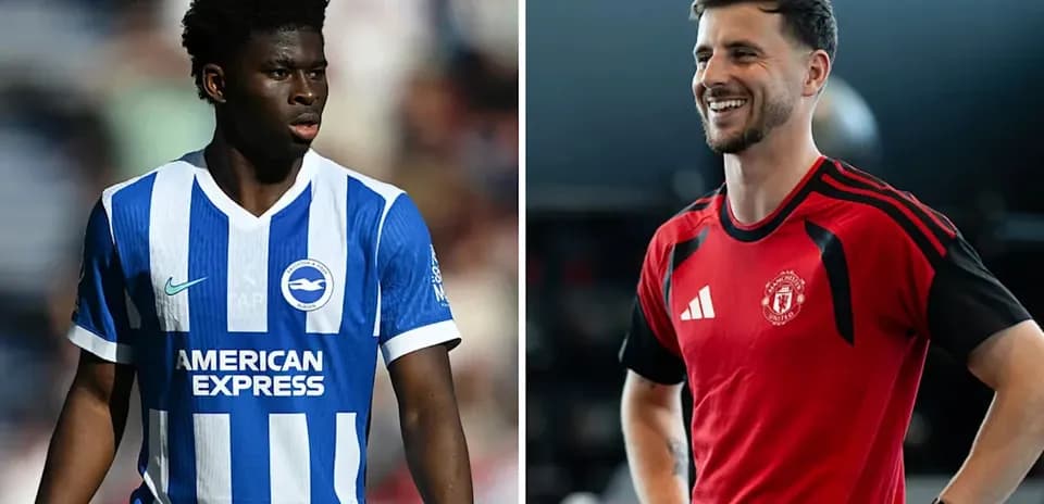 Two football players in team kits, one training