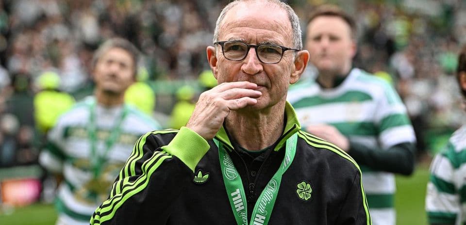 Celtic manager on field with team members