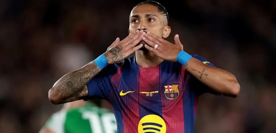 Player celebrating with a kiss gesture during match