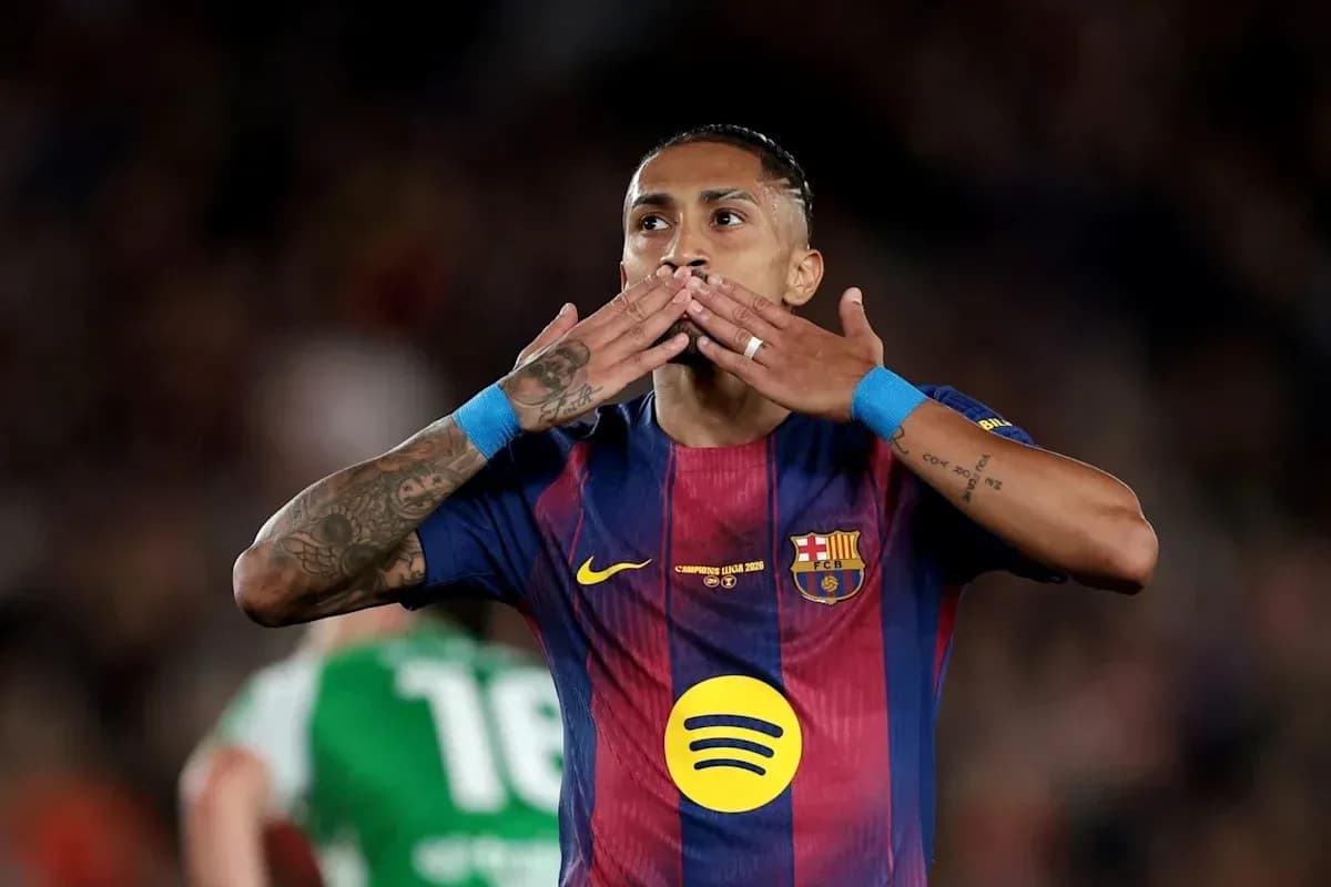 Player celebrating with a kiss gesture during match