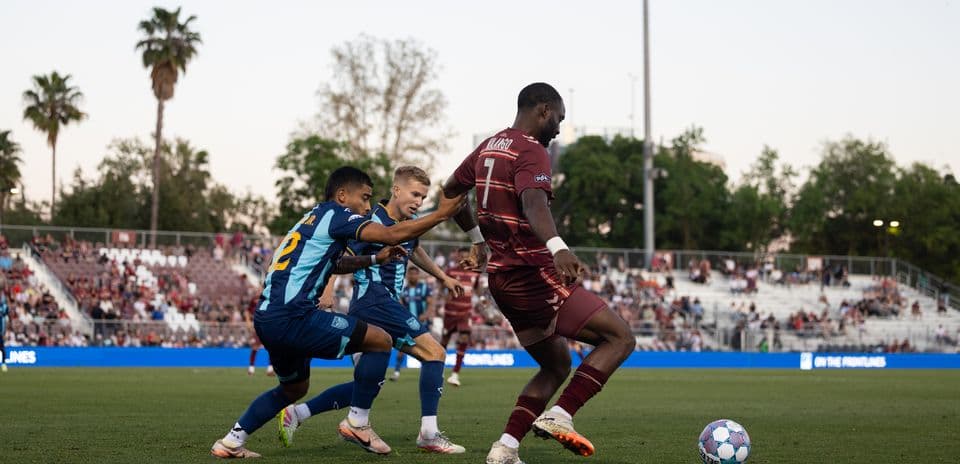 Two players challenging for the ball during match