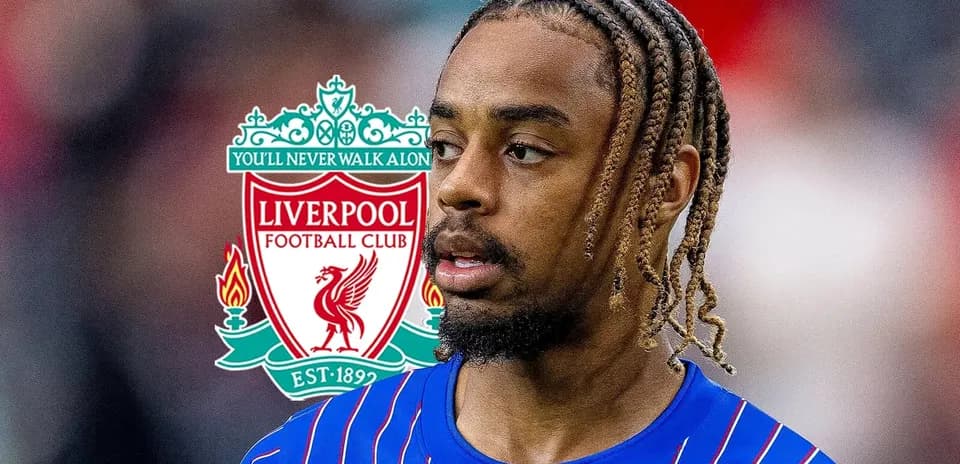 Player in Liverpool kit with club logo background