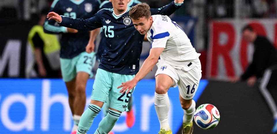 Two players battling for the ball during match