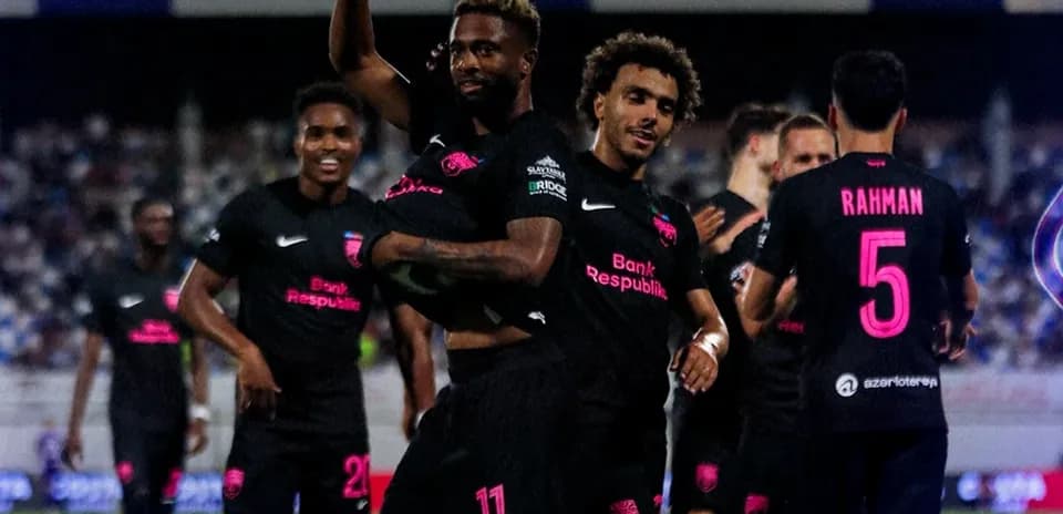 Players celebrating a goal during match