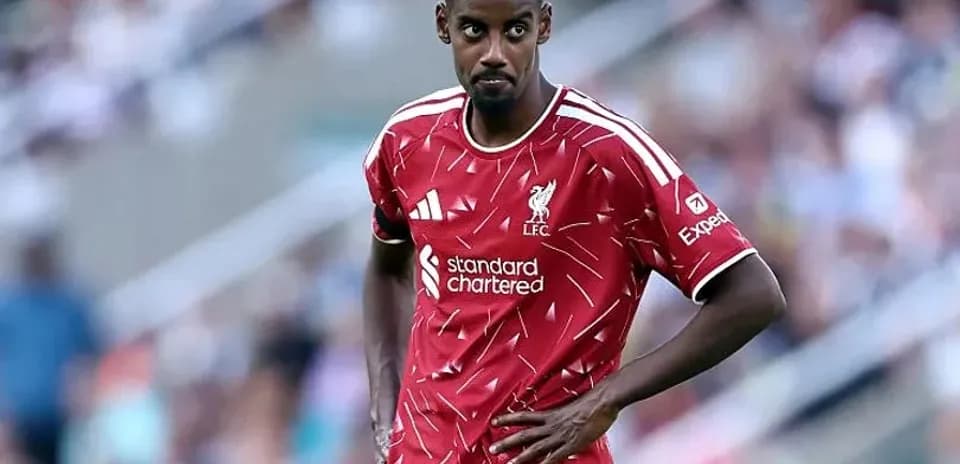 Player wearing Liverpool jersey on the field