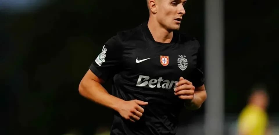 Player running in black jersey during match