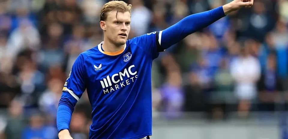 Player in blue jersey gesturing during match