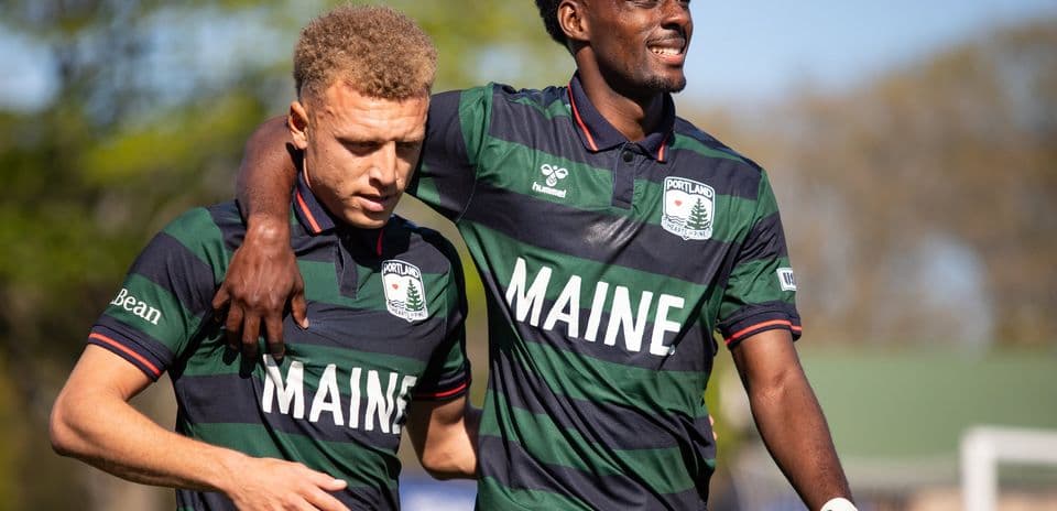 Two Portland Hearts of Pine players celebrating