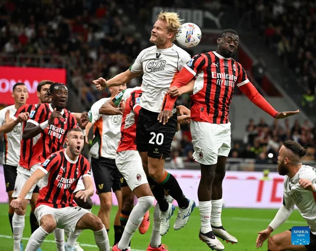 Players competing for a header during match