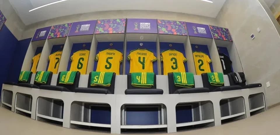 Team locker room with yellow jerseys displayed