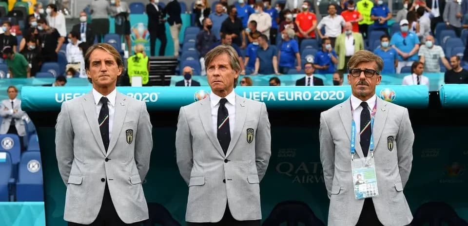 Three coaches in suits during UEFA Euro 2020