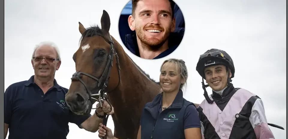 Three people posing with a racehorse outdoors