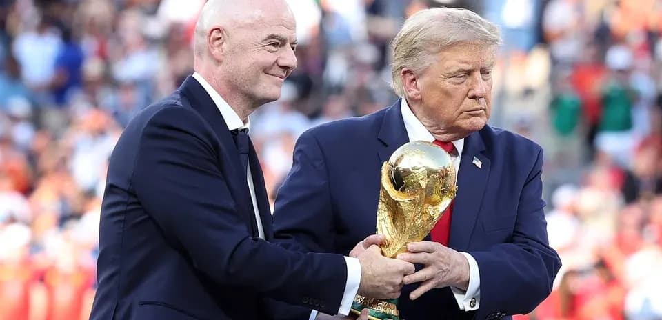 Gianni Infantino handing FIFA World Cup trophy to Donald Trump