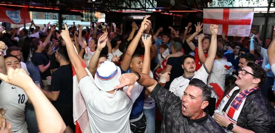 Crowd of fans celebrating during a sports event