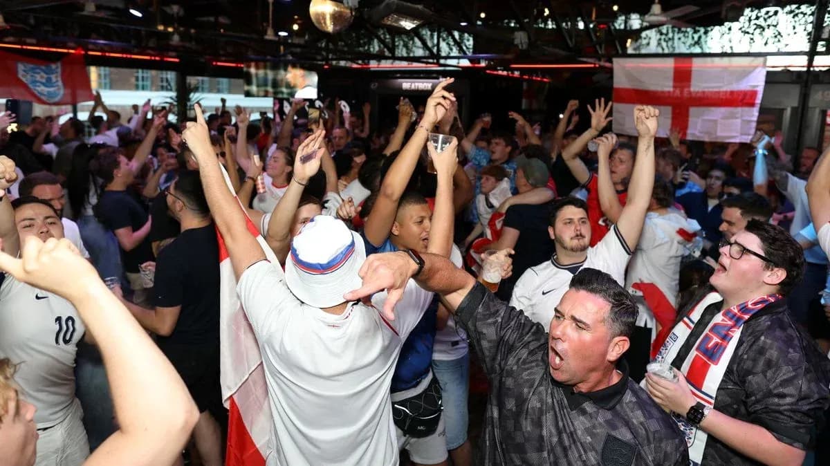 Crowd of fans celebrating during a sports event