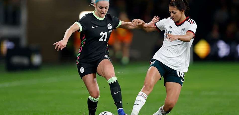 Players competing for the ball during soccer match