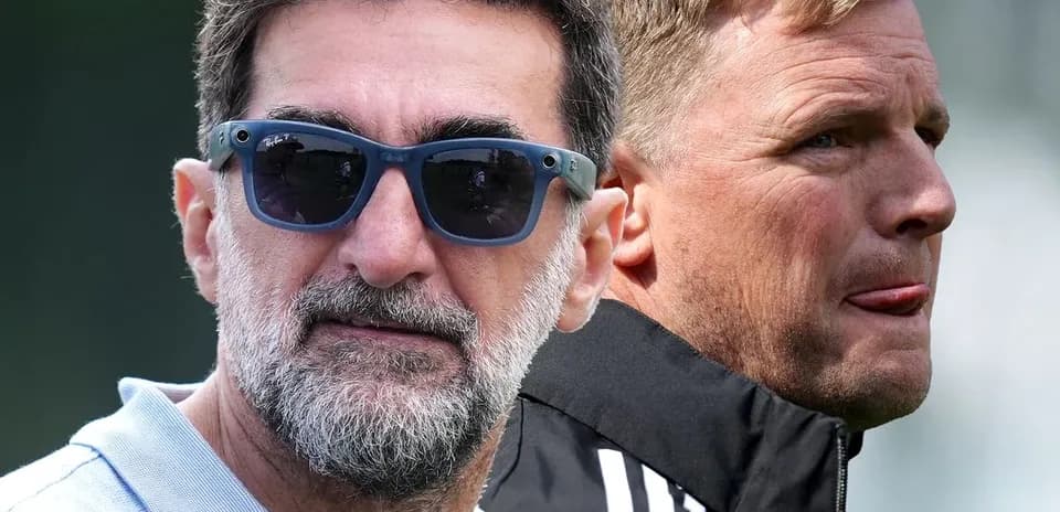 Two coaches observing training session outdoors