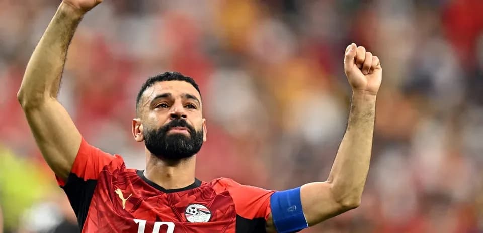 Egyptian player celebrating with raised fists on field