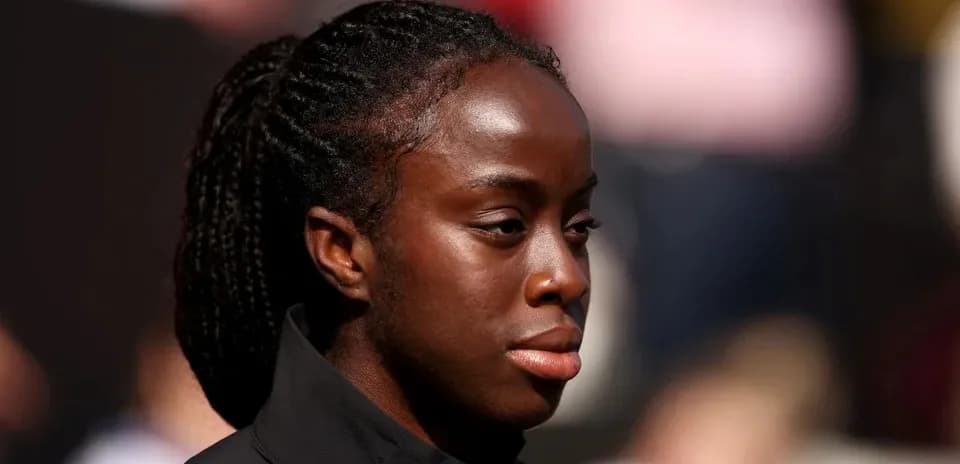 Athlete with braided hair during event preparation