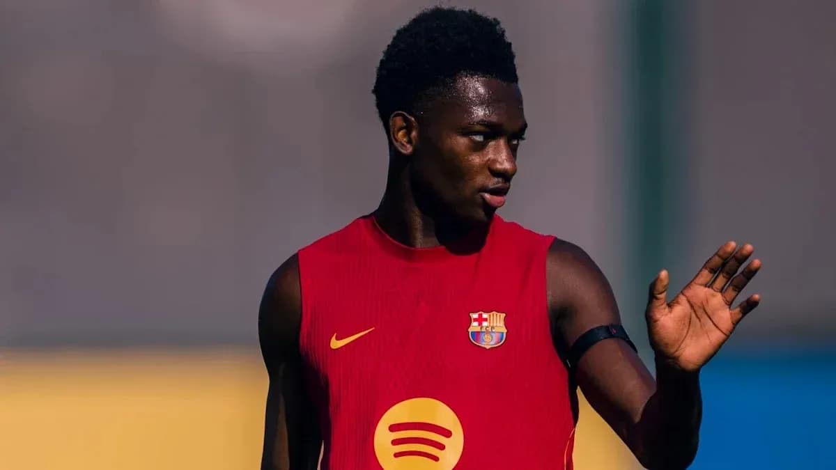 Player in red jersey gesturing during training session