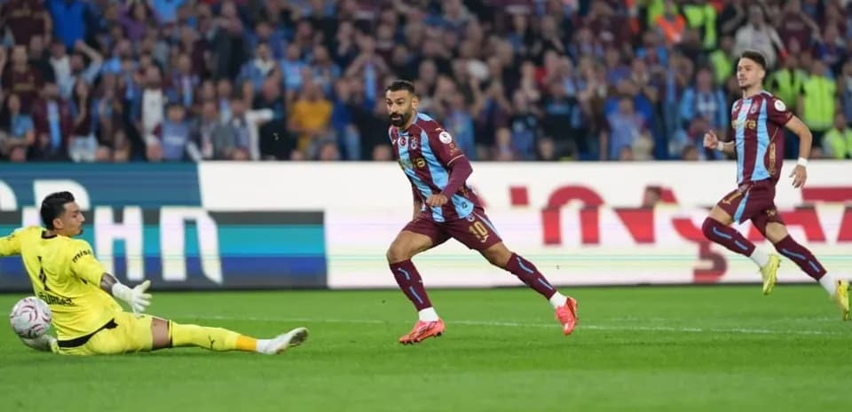 Player scoring against the goalkeeper during match