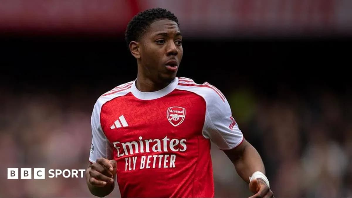 Arsenal player running on the pitch during match
