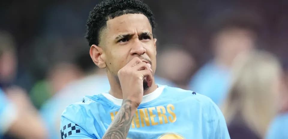 Player in blue jersey deep in thought