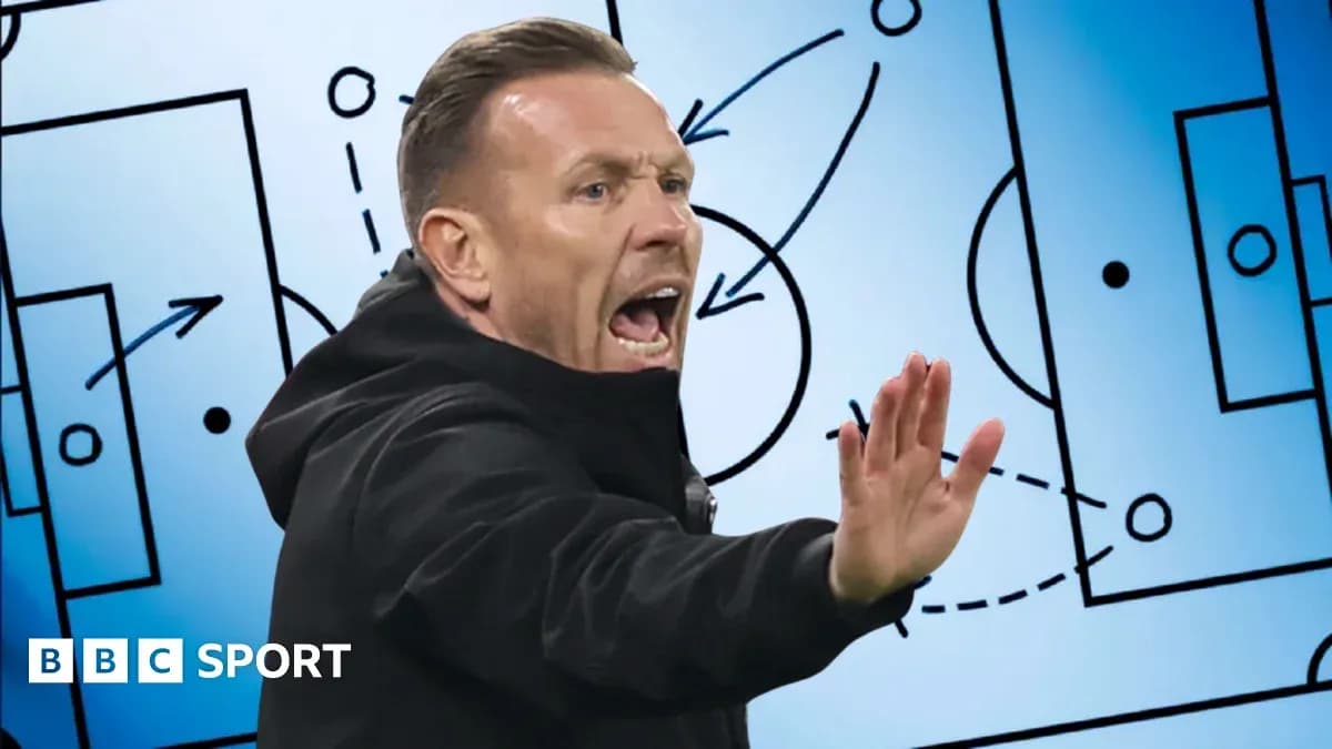 Coach giving instructions with tactical board background